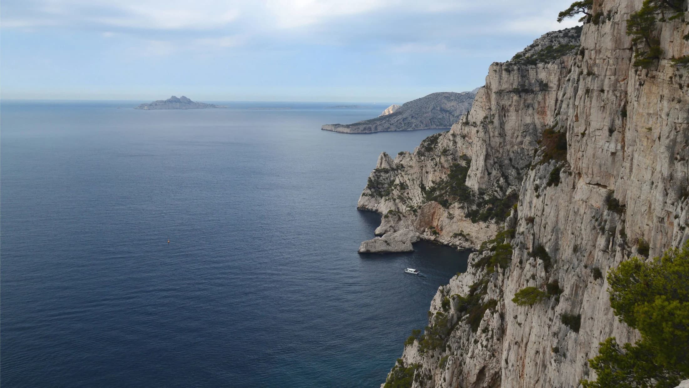 Still water and the pale limestone cliffs of the Calanques