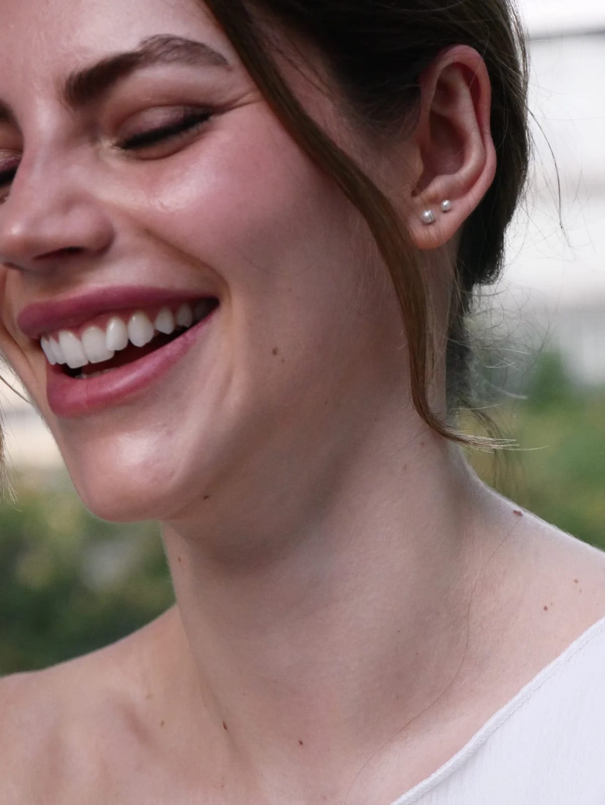 A close-up of Valentina laughing between takes.